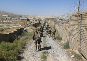 U.S. military advisers from the 1st Security Force Assistance Brigade walk at an Afghan National Army base in Maidan Wardak province, Afghanistan August 6, 2018. REUTERS/James Mackenzie