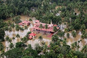 An aerial view shows partially submerged houses at a flooded area in the southern state of Kerala, India, August 17, 2018. REUTERS/Sivaram V