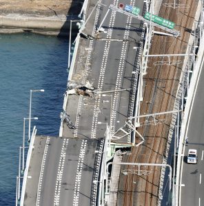 A bridge connecting Kansai airport, damaged by crashing with a 2,591-tonne tanker, which is sent by strong wind caused by Typhoon Jebi, is seen in Izumisano, western Japan, in this photo taken by Kyodo September 5, 2018. Kyodo/via REUTERS