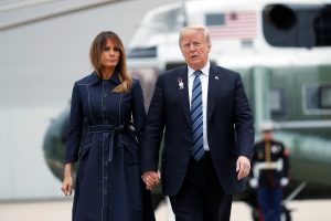 U.S. President Donald Trump and first lady Melania Trump hold hands and talk as they walk from the Marine One helicopter to Air Force One at John Murtha Johnstown-Cambria County Airport prior to departing Johnstown, Pennsylvania, U.S., September 11, 2018. REUTERS/Kevin Lamarque