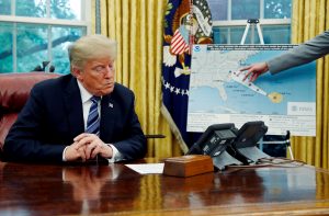 U.S. President Donald Trump holds an Oval Office meeting on hurricane preparations as FEMA Administrator Brock Long points to the potential track of Hurricane Florence on a graphic at the White House in Washington, U.S., September 11, 2018. REUTERS/Leah Millis