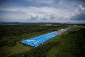 About 20,000 pallets of unused water bottles are seen along an airplane runway a year after Hurricane Maria devastated Puerto Rico in Ceiba, Puerto Rico, September 18, 2018. Picture taken September 18, 2018. REUTERS/Carlos Barria