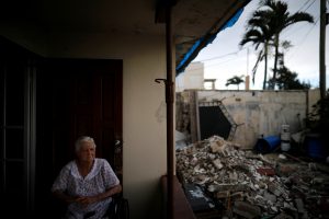 Lucila Cabrera, 86, sits at the porch of her damaged house by Hurricane Maria, a year after the storm devastated Puerto Rico, near Barceloneta, Puerto Rico, September 18, 2018. Picture taken September 18, 2018. REUTERS/Carlos Bar
