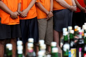 FILE PHOTO: Suspects arrested over the production and sale of illegal alcohol which claimed the lives of more than 80 people this week in Jakarta and nearby West Java province, are seen during a police a press conference in Jakarta, Indonesia April 11, 2018. REUTERS/Willy Kurniawan/File Photo