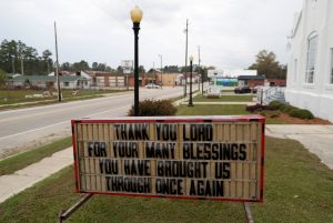 A sign in front of the Fair Bluff United Methodist Church gives a message to the community after flooding due to Hurricane Florence receded in Fair Bluff, North Carolina, U.S. September 29, 2018. REUTERS/Randall Hill
