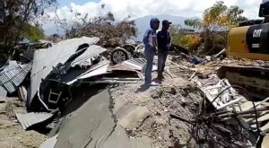 Debris and damaged property are seen following an earthquake in Petobo, Central Sulawesi, Indonesia, October 3, 2018, in this still image obtained from a social media video. Palang Merah Indonesia (Red Cross)/via REUTERS.