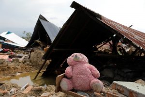 A soft toy is seen among the ruins of a house after an earthquake hit the Balaroa sub-district in Palu, Indonesia, October 4, 2018. REUTERS/Beawiharta