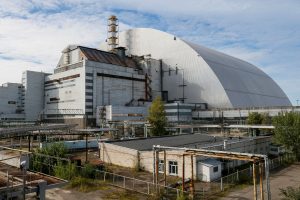 A new Safe Confinement arch covering the damaged fourth reactor of the Chernobyl nuclear power plant is seen near a newly built solar power plant in Chernobyl, Ukraine October 5, 2018. REUTERS/Gleb Garanich