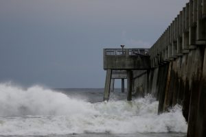 Waves crash along a pier as Hurricane Michael approaches Panama City Beach, Florida, U.S. October 9, 2018. REUTERS/Jonathan Bachman