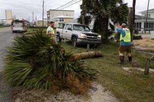 Emergency crews work to clear a street of debris during Hurricane Michael in Panama City Beach, Florida, U.S. October 10, 2018. REUTERS/Jonathan Bachman