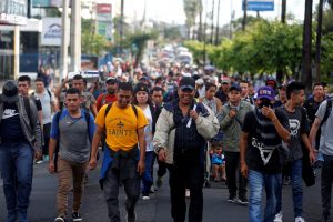 People walk in a caravan of migrants departing from El Salvador en route to the United States, in San Salvador, El Salvador, October 28, 2018. REUTERS/Jose Cabezas