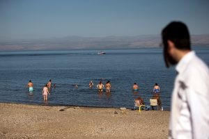 People cool off in the Sea of Galilee in northern Israel November 1, 2018. Picture taken November 1, 2018. REUTERS/Ronen Zvulun