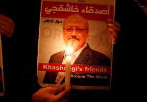 FILE PHOTO: A demonstrator holds a poster with a picture of Saudi journalist Jamal Khashoggi outside the Saudi Arabia consulate in Istanbul, Turkey October 25, 2018. REUTERS/Osman Orsal/File Photo