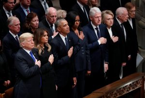 U.S. President Donald Trump and first lady Melania Trump stand with former President Barack Obama, former first lady Michelle Obama, former President Bill Clinton, former first lady Hillary Clinton, former President Jimmy Carter and former first lady Rosalynn Carter in the front row at the state funeral for former U.S. President George H.W. Bush at the Washington National Cathedral in Washington, U.S., December 5, 2018. REUTERS/Kevin Lamarque