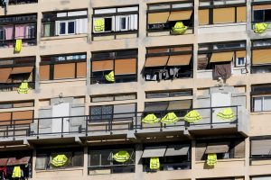 Yellow vests are hung outside windows of an apartment building in support of the "yellow vests" movement in Marseille, France, December 7, 2018. REUTERS/Jean-Paul Pelissier