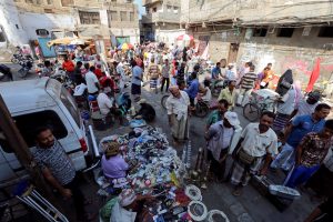 People gather near stalls with used tools on a street in Hodeidah, Yemen December 15, 2018. REUTERS/Abduljabbar Zeyad