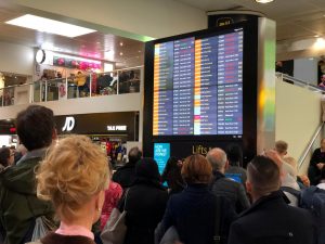 Stranded passengers look at the departures board at Gatwick Airport, Britain, December 20, 2018 in this picture obtained from social media. Ani Kochiashvili/via REUTERS