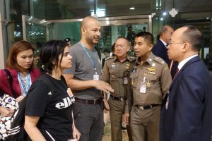Saudi teen Rahaf Mohammed al-Qunun is seen with Thai immigration authorities at a hotel inside Suvarnabhumi Airport in Bangkok, Thailand January 7, 2019. Thailand Immigration Police via REUTERS