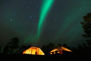 FILE PHOTO: The Aurora Borealis (Northern Lights) is seen over a mountain camp north of the Arctic Circle, near the village of Mestervik late October 1, 2014. REUTERS/Yannis Behrakis