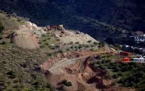 Diggers and trucks remove sand at the area where Julen, a Spanish two-year-old boy fell into a deep well four days ago when the family was taking a stroll through a private estate, in Totalan, southern Spain, January 17, 2019. REUTERS/Jon Nazca