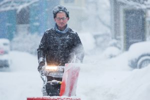 Man blows snow during a winter storm in Buffalo, New York, U.S., January 30, 2019. REUTERS/Lindsay Dedario