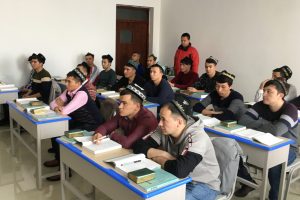 FILE PHOTO: Islamic studies students attend a class at the Xinjiang Islamic Institute during a government organised trip in Urumqi, Xinjiang Uighur Autonomous Region, China, January 3, 2019. REUTERS/Ben Blanchard/File Photo