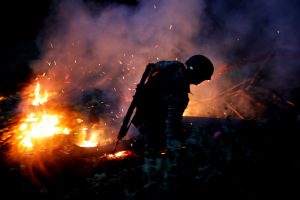 A soldier burns an illegal opium plantation near Pueblo Viejo in the Sierra Madre del Sur, in the southern state of Guerrero, Mexico, August 24, 2018. REUTERS/Carlos Jasso